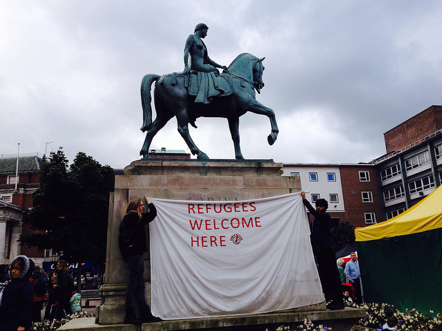 banner under Godiva statue 'Refugees welcomed here'